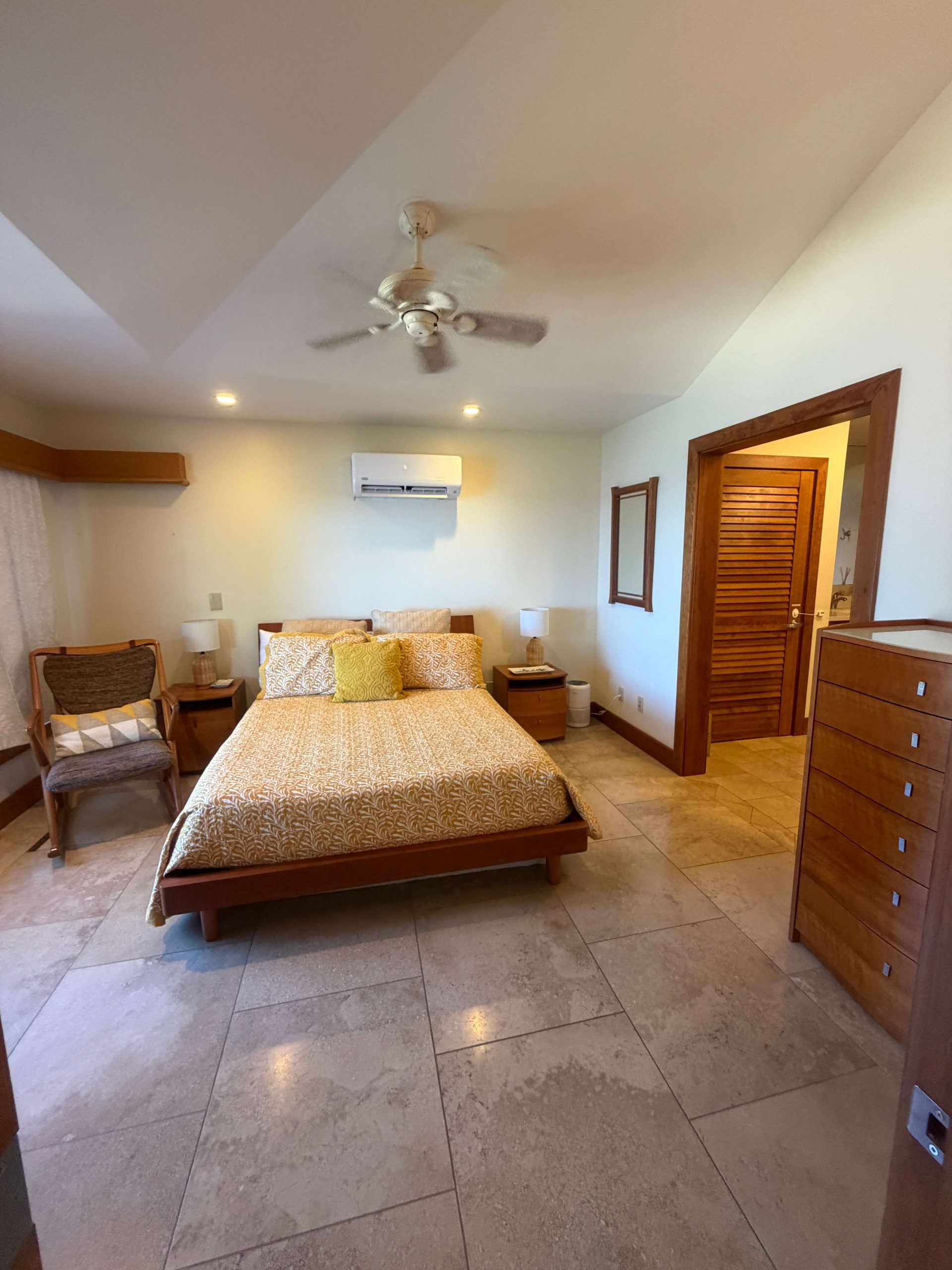 Bright bedroom suite with golden bedding